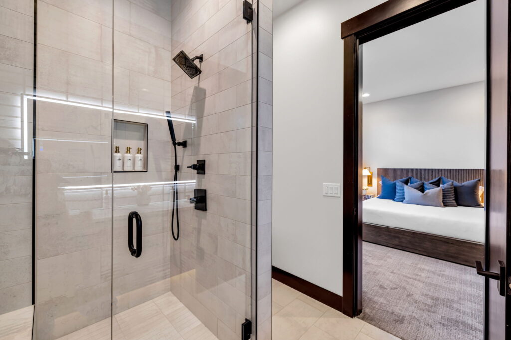 view of the shower and connecting bedroom